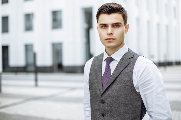 Portrait of young business men in a modern city