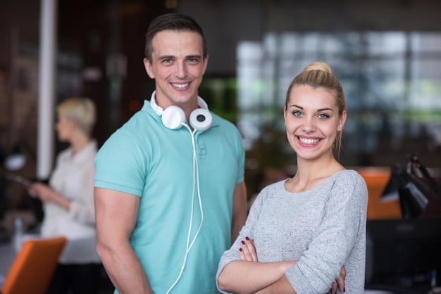 Portrait of young business people discussing business plan  in the startup office