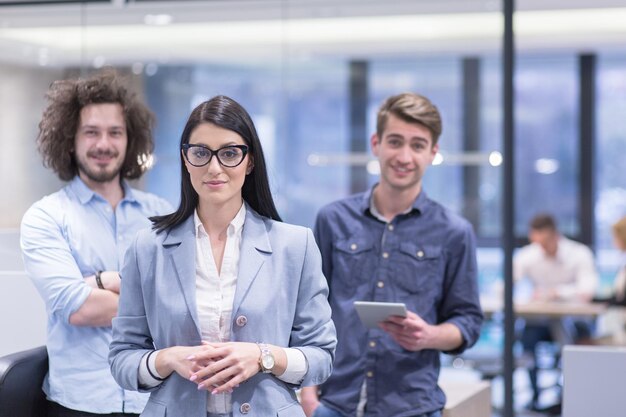 Portrait of young business people discussing business plan  in the startup office