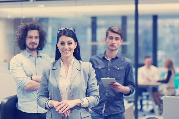 Portrait of young business people discussing business plan  in the startup office