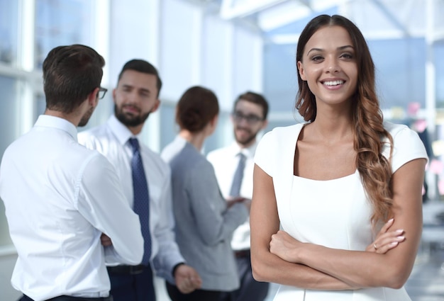 Portrait of a young business woman on the background of the office  business people