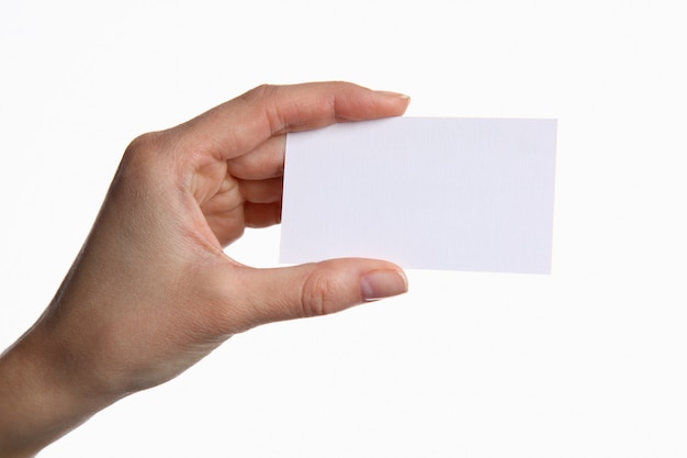 Portrait of young business woman holding blank white business card