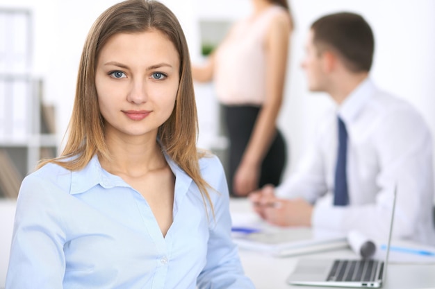 Portrait of a young business woman  at meeting.