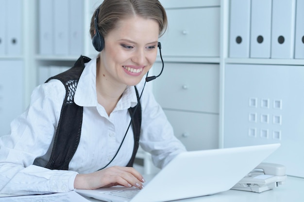 Portrait of a young business woman working at office