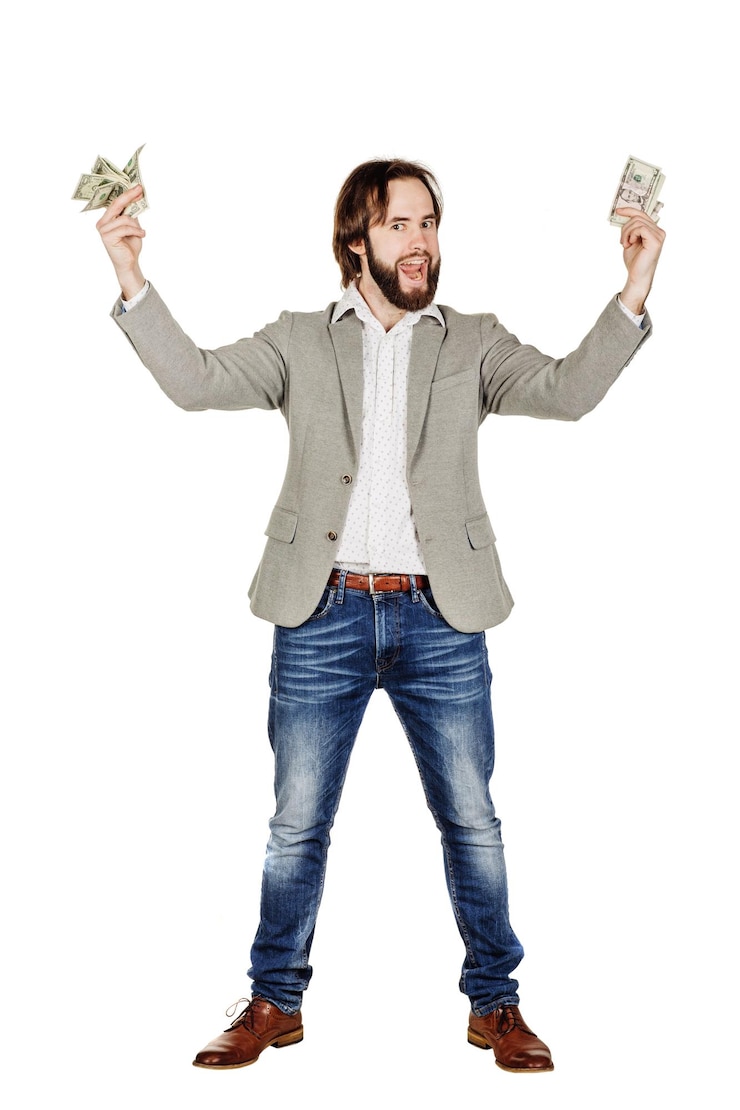 Photo portrait of young businessman holding and counts money dollar bills in hands isolated on white background emotion facial expression feeling financial reward savings