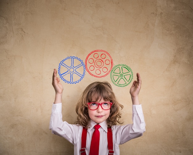 Portrait of young businessman kid in office. Creative business concept