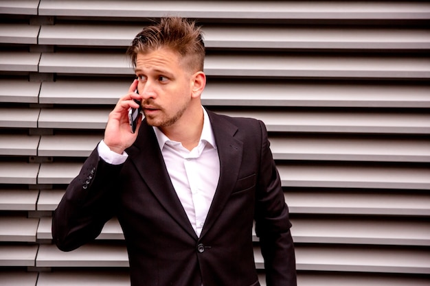 Portrait of a young businessman talking on the phone