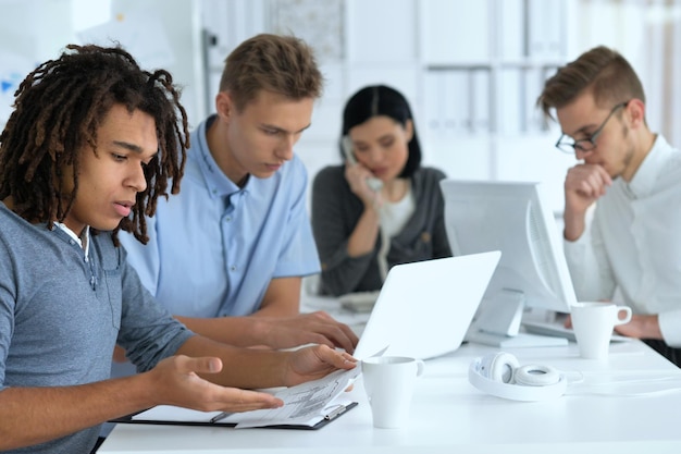 Portrait of a young businesspeople working in ofiice