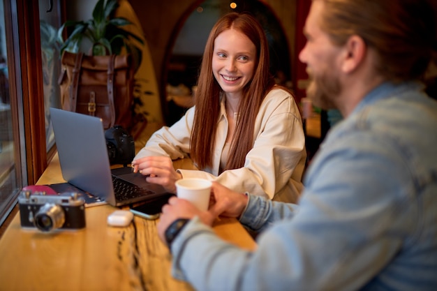 Portrait of young businesswoman and businessman at cozy cafe.freelance and remote work