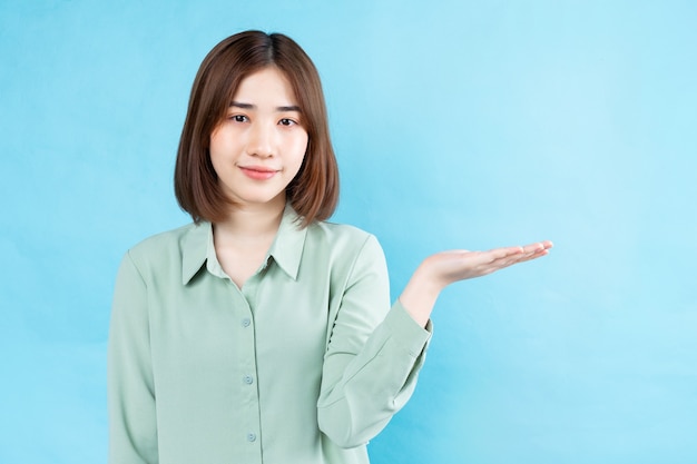 Portrait of young businesswoman on white background