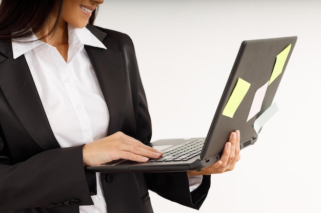 Portrait of a young businesswoman with a laptop in her hands