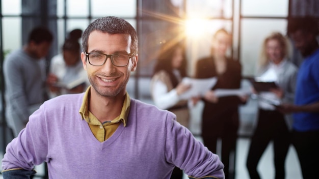 Portrait of a young casual man with glasses in everyday clothes