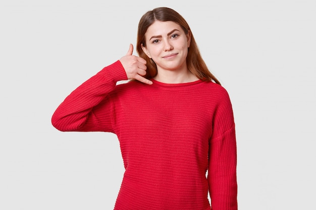 Portrait of young caucasian beautiful young woman dressed casual red sweater