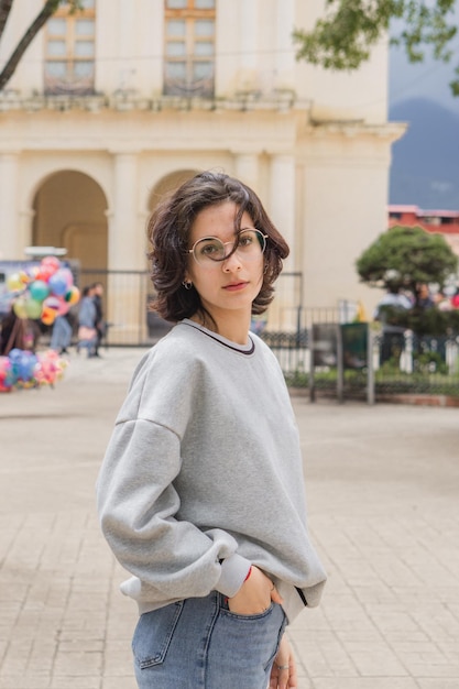 Portrait of a young caucasian woman looking at the camera.