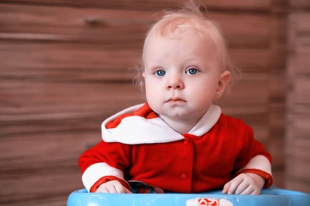 Portrait of a young child with blue eyes in a room