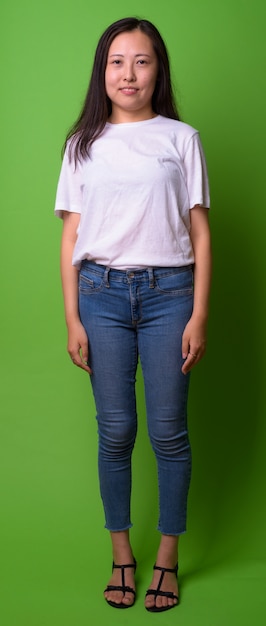 portrait of young Chinese woman on green