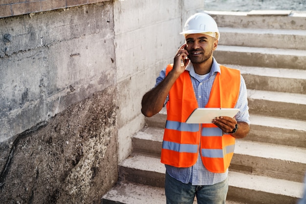 Portrait of young construction engineer wearing hardhat