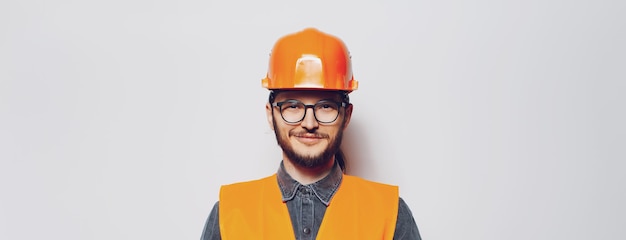 Portrait of young construction worker on white background Panoramic banner