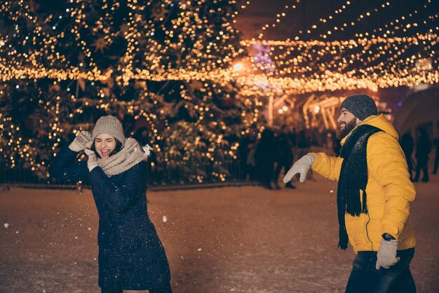 Portrait of a young couple in the city on Christmas holiday