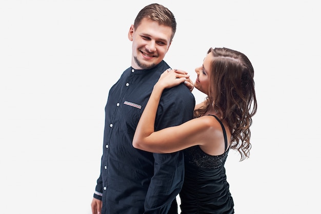 Portrait of young couple in elegant evening dress and shirt isolated on white.