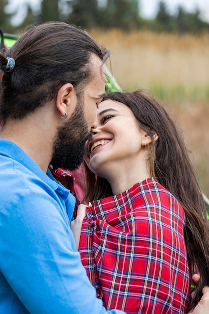 Portrait of young couple looking at each other some smiling