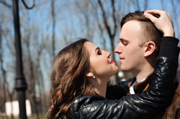 Portrait of young couple in love in a park