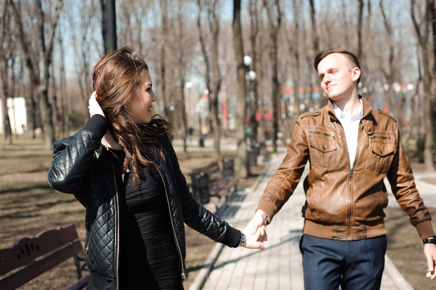 Portrait of young couple in love in a park.