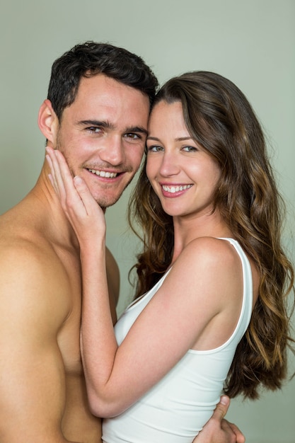 Portrait of young couple smiling in bathroom