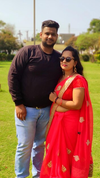 Portrait of young couple standing outdoors