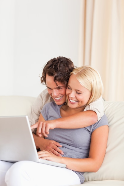 Portrait of a young couple using a notebook