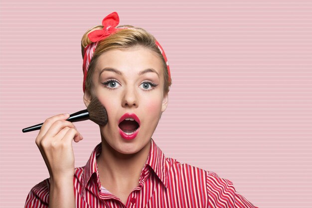 Portrait of young cute woman on background