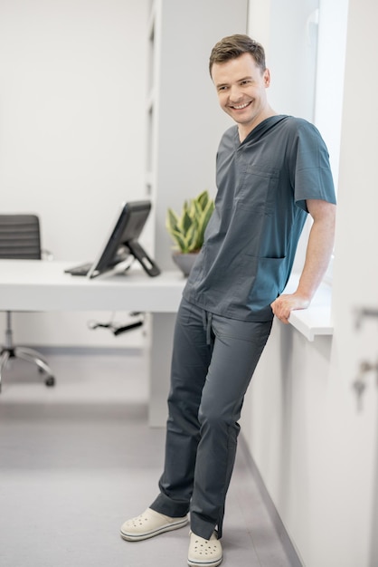 Portrait of young doctor at clinic