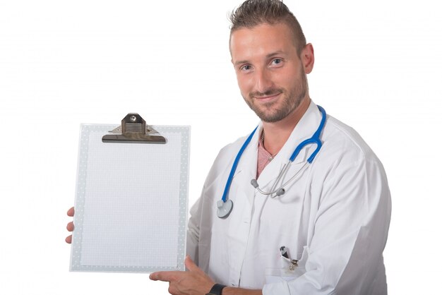 Portrait of a young doctor showing a clipboard on white