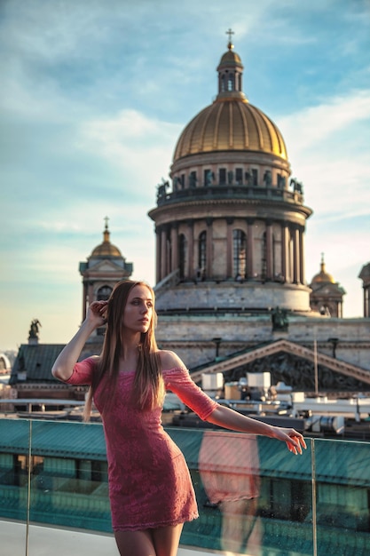 Portrait of young elegant blonde woman posing outdoors