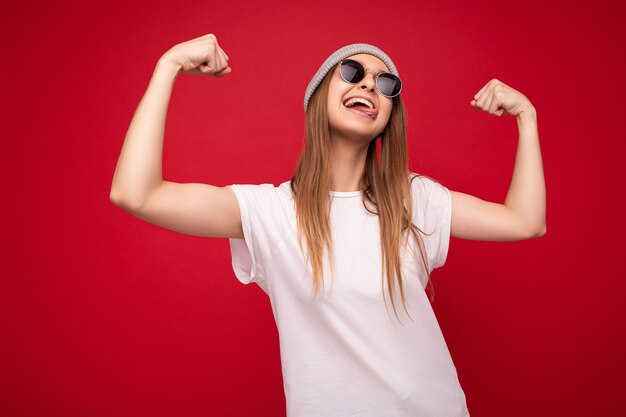 Portrait of young emotional positive happy attractive dark blonde woman with sincere emotions