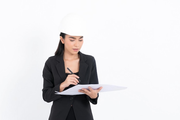 Portrait young engineer woman is submitting ideas about plans and projects, while holding blueprints and a pen in hand at shot studio isolated on white background.