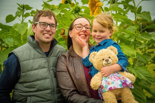 Portrait of young family with toy