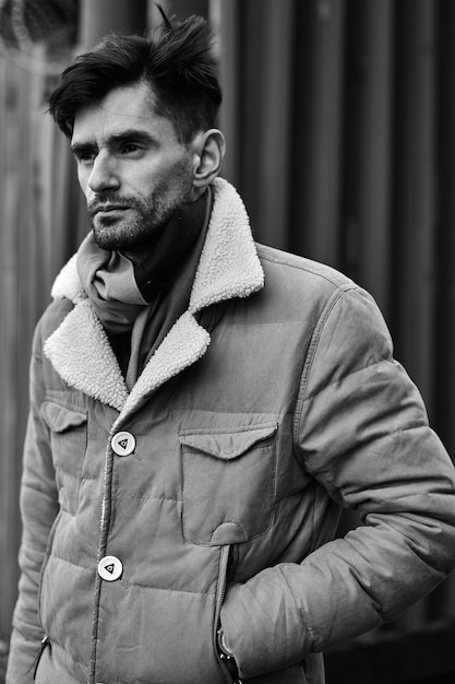 Portrait of young fashionable guy on the street