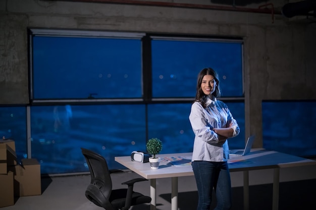 portrait of young female architect on construction site checking documents and business workflow using laptop computer in new startup office