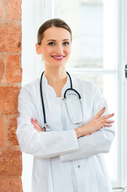 Portrait of young female doctor in clinic