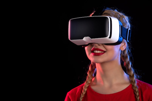 Portrait of young female playing virtual reality on dark  game visual ultrasound