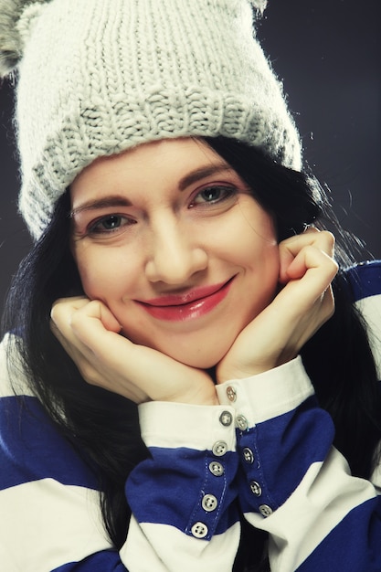 Portrait of young funny woman, wearing hat.