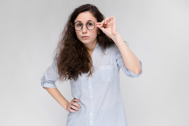 Portrait of a young girl in glasses