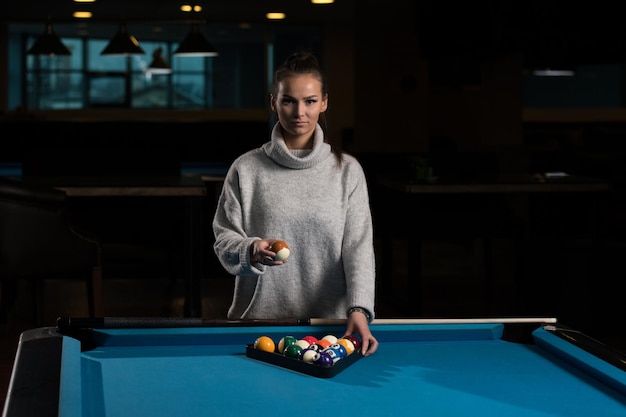 Portrait Of A Young Girl Playing Billiards