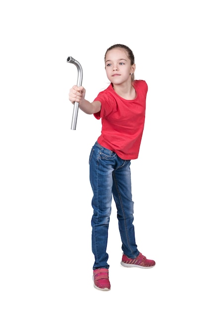 Portrait of a young girl in a red T-shirt with a wheeled wrench in his hand isolated on a white background