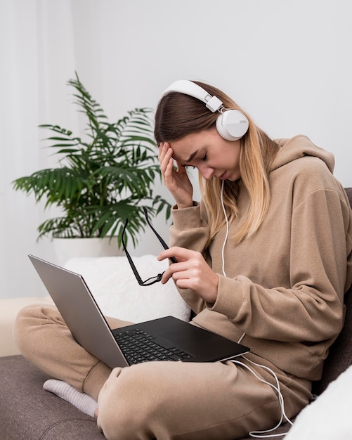 Portrait  young girl using headphones