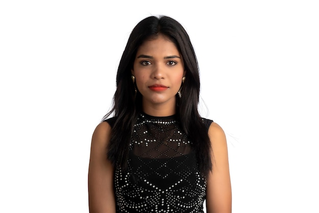 Portrait of a young girl wearing black dress posing on a white background