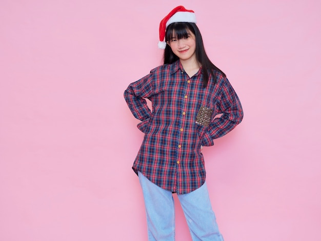 Portrait of young girl wearing santa hat. Christmas concept.