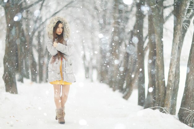 portrait of young girl winter snow outside