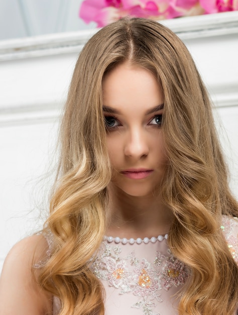 Portrait of a young girl with long  blonde hair 